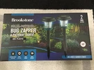 Brookstone Solar Powered Bug Zapper & Pathway Lights / Pack Of 2 New Unopened. Fixed Price $10.00.