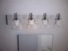 Hampton Bay Manor 33IN. 4-LIGHT Polished Nickel Industrial Bathroom Vanity. Fixed Price $50.96.