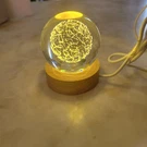 3D Crystal Ball Night Light Glass Lamp With Wooden Base World Glove. Fixed Price $24.00.