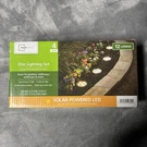 Mainstays Solar Led Pathway Lights 4 Pack, Weather Resistant, Warm White, Silver. Fixed Price $12.00.