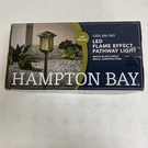 Hampton Bay Outdoor Integrated Led Path Light, Flame Effect, Black, 62906. Fixed Price $34.99.