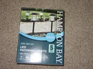 Hampton Bay Solar Zinc Outdoor Integrated Led Landscape Pathway Lights 5 Pack. Fixed Price $59.95.