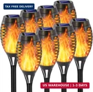 Eoyizw 8 Pack Solar Torch With Flickering Flame, 12 Leds Lights Outd. Fixed Price $39.86.