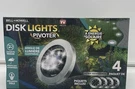 Four New Bell + Howell Led Solar Waterproof Pivoting Outdoor Garden Disk Lights. Fixed Price $12.95.