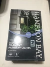 Hampton Bay Solar Black Outdoor Led Shepherd Hook Path Light 2 Pack 1006683616. Fixed Price $45.00.